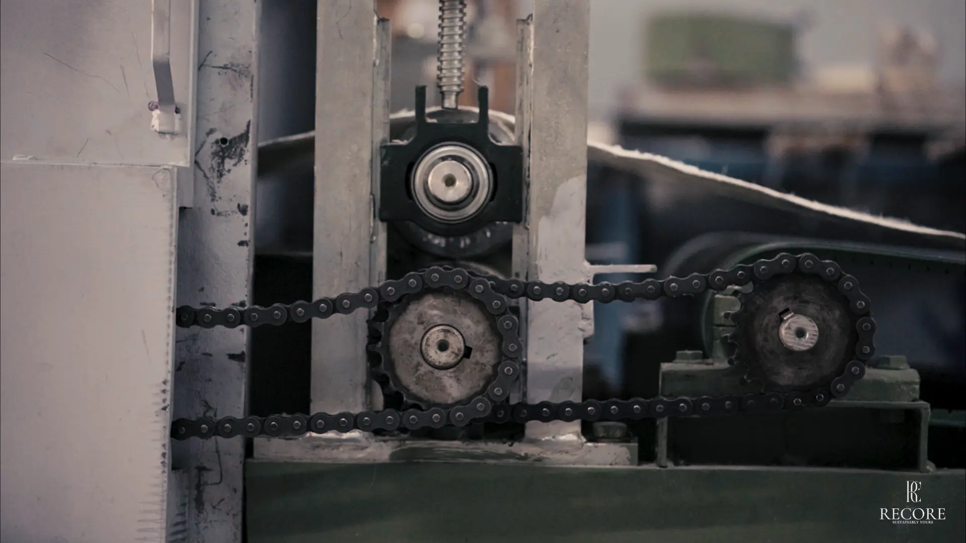Industrial fibre processing machinery with chain-driven rollers at a RECORE™ facility